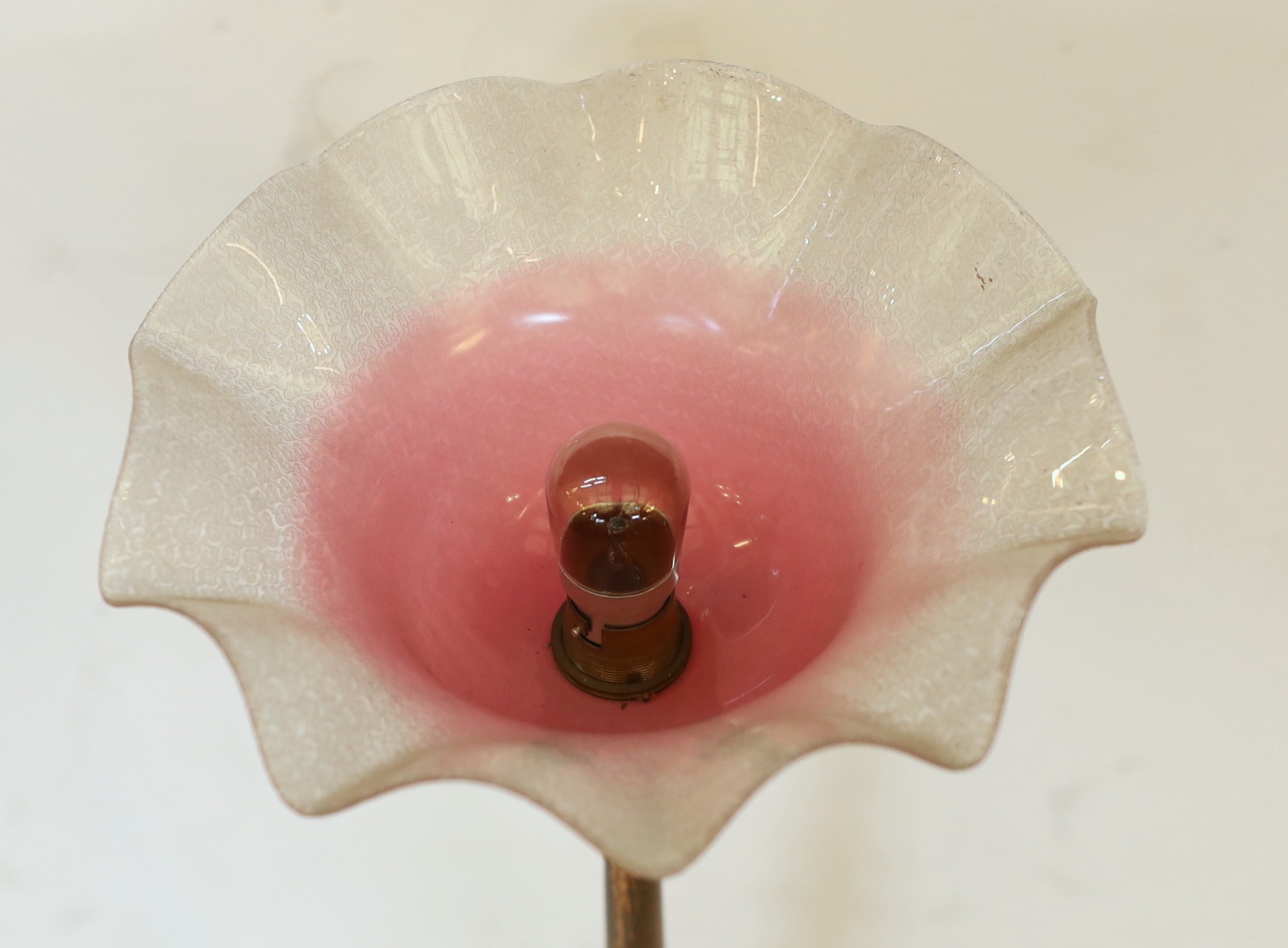 A late 19 century English lacquered bronze and glass table lamp with edged pink glass shade, height overall 51cm